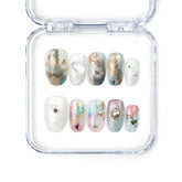 Naillover Mermaid Sparkle handmade press on nails in smoky green and purple jelly tones with gold foil, short oval shape, made in Singapore.